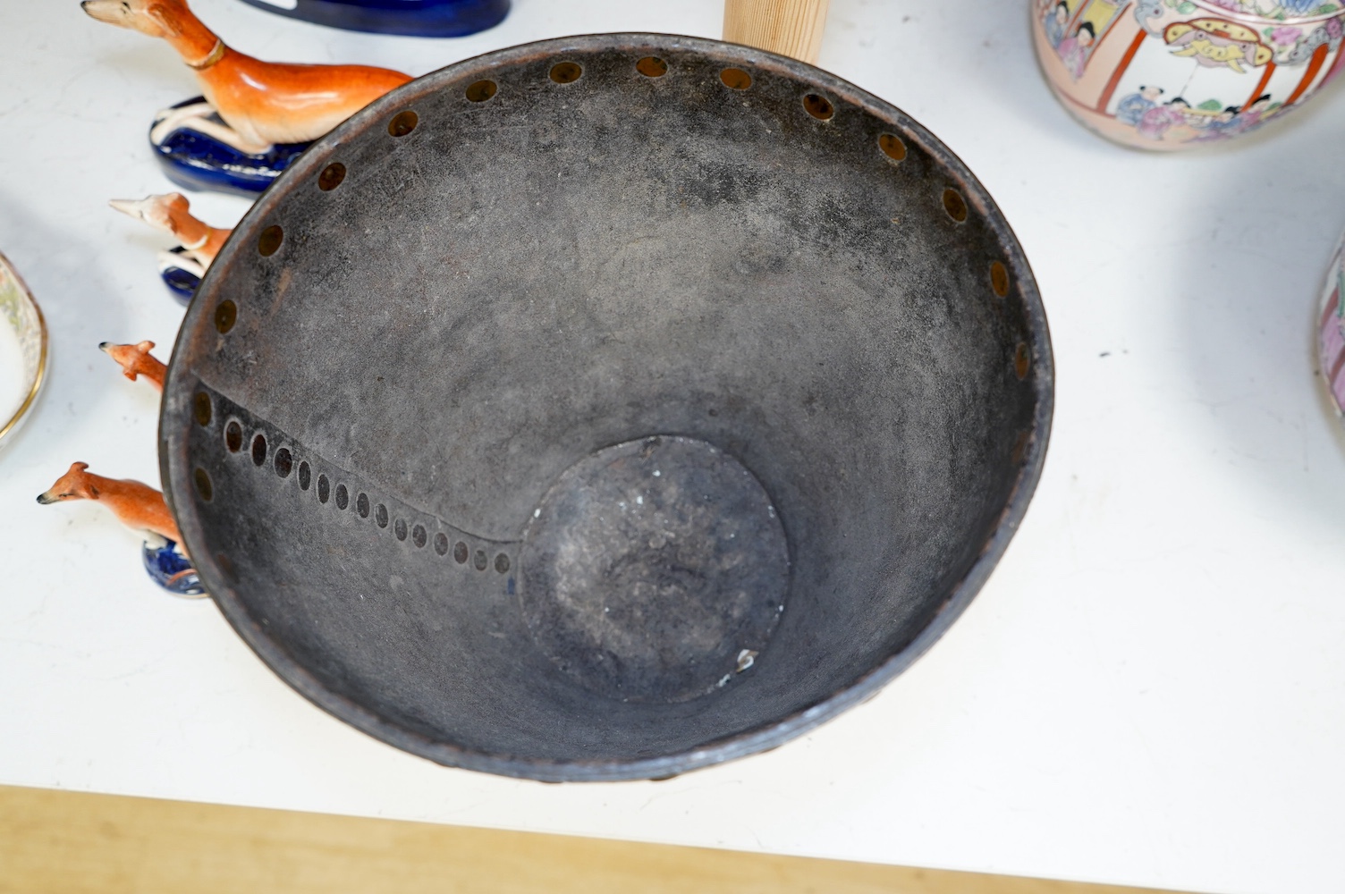 A Georgian mounted leather fire bucket (waste paper bin), 27cm high. Condition - fair